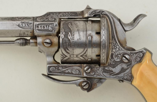 An engraved Lefaucheux pinfire revolver with folding trigger and ivory grips.  Belgian proof marks, 