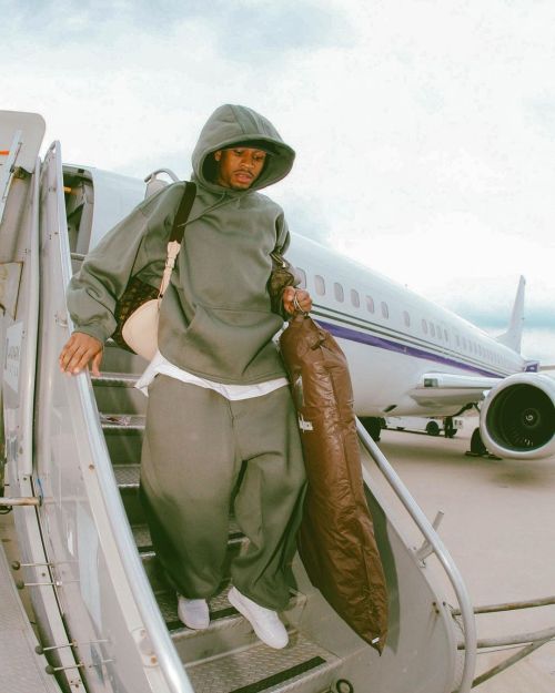 halfdayss:Allen Iverson photographed by Garret W. Ellwood while getting off the team charter plane i