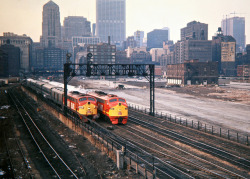 marmarinou:  CRIP, Chicago, Illinois, 1972 by railphotoart on Flickr. Chicago, Rock Island and Pacific Railroad westbound passenger trains nos. 5 and 9 leaving LaSalle Street Station in Chicago, Illinois, on April 1, 1972. No. 5 is the Des Moines Rocket