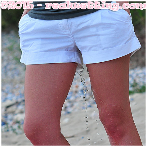 Double wetting from two sexy girls playing volleyball on the beach.