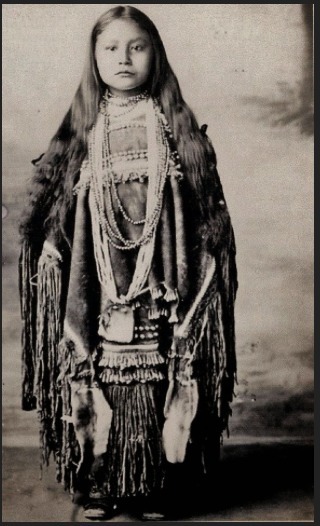 ochipi:Young Apache girl in traditional dress.