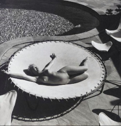 Marilyn Monroe lying naked on a trampoline,