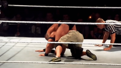 Randy Orton coiled around John Cena (X)