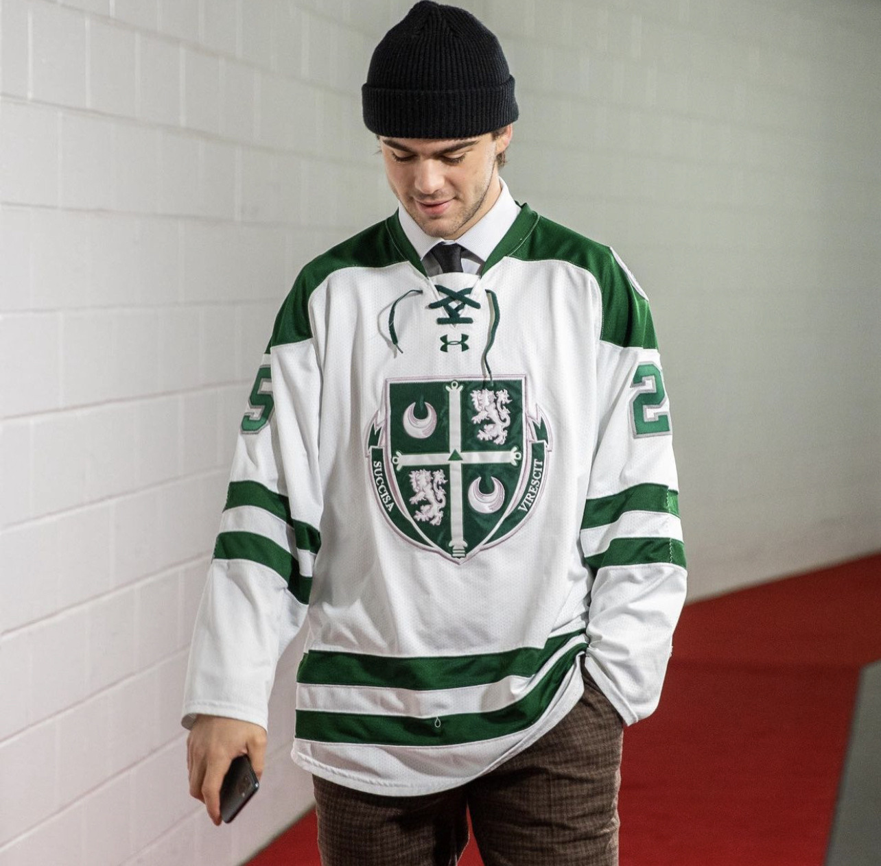 Devils players and Nas repping NJ high school hockey jerseys