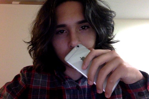 paradise-jpg:  how to pick your nose using iPhone, only thing its useful foron side note i think its time for a trim  cutie