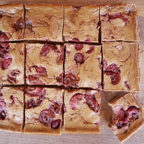 Strawberry Swirl Cheesecake Bars!  A delicious crust is topped with creamy cheesecake and swirls of 