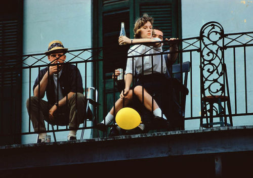 Three friends look down from a balcony in New Orleans, 1960 by Ernst Haas