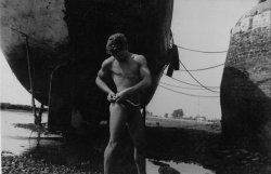 malesinphotos:Male Figure and Ship’s Hull,