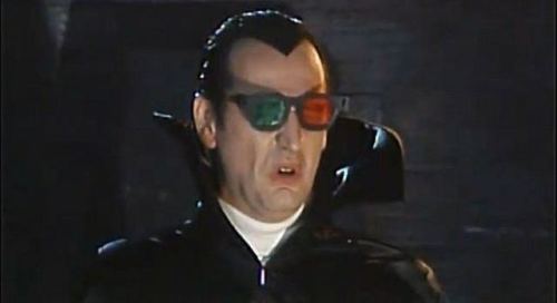 Joe Flaherty as Count Floyd watching Dr. Tongue’s 3D House of Stewardesses on SCTV, 1981.  Also feat