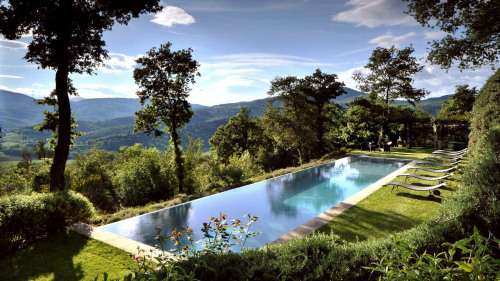 shutcherface:  gatsbyinspired:  vmagazine:  Stretching over thousands of acres of olive groves and forests in the Umbrian hills; Castello Di Reschio Luxury Villas in Umbria, Italy has been restored from secluded ancient farmhouses to contemporary guest