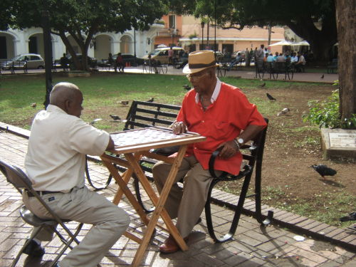 photodominican:Dominican men playing dominoes in Plaza Colon, in the Colonial Zone of Santo Domingo,