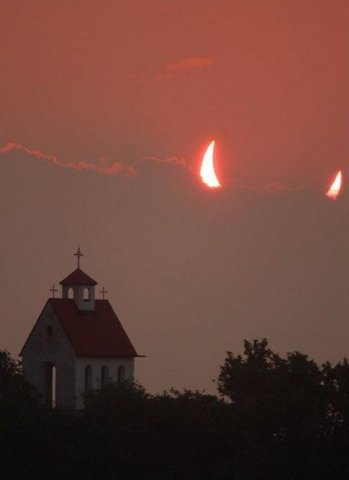 ask-greta-the-fangirl:  sixpenceee:  The devil’s eclipse right above a church. 