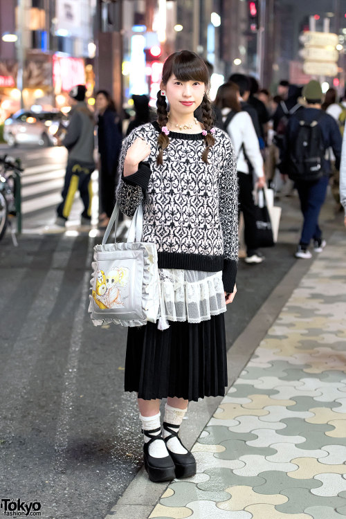 Asumi on the street in Harajuku wearing a knit sweater over sheer top, pleated skirt, Tokyo Bopper p