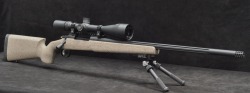 tombstone-actual:  27wordsworthfightingfor:  Long action Remington 700 in a McMillan A3, sitting on an Atlas bipod, and a Nightforce scope on top.  hotdamn  