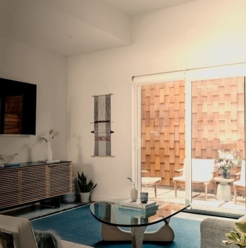 Open - Living RoomExample Of A Formal, Mid-sized Living Room In The Beach Style, With A Concrete Floor