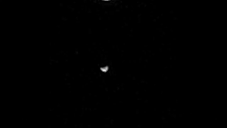 jtotheizzoe:  That one time that the Curiosity rover looked up and captured two of Mars’ moons in one shot. Phobos and Deimos, like two ships passing in the Martian night. Good lookin’ out, Curiosity. Full video at NASA’s internet HQ. 