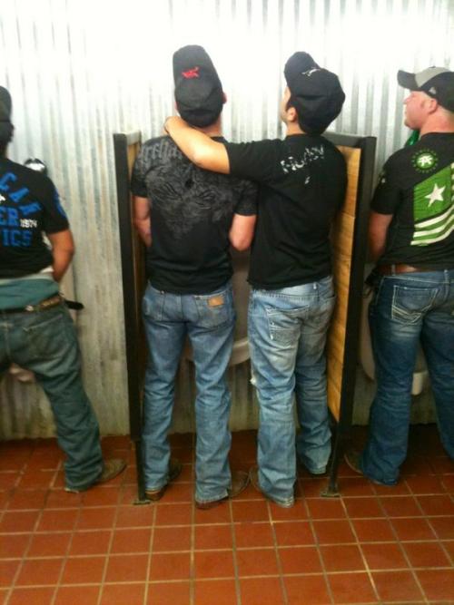 Southern boys sharing a urinal in a busy public bathroom
