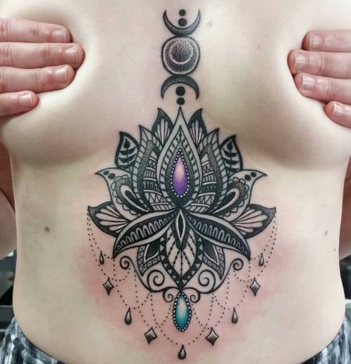 righteousraving:  satanicspacecat:  Excuse the redness but I really enjoyed doing this piece today. Thanks for sitting like a champ Beck 👊 #tattoo #theoldeenglish #dotwork #dotworktattoo #mandala #mandalatattoo #blackwork #lotustattoo #underboobtattoo