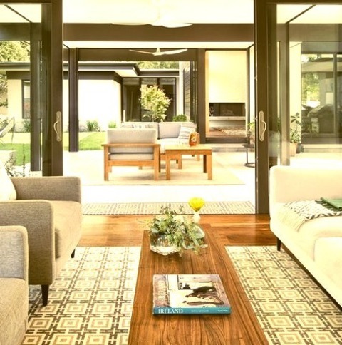 Living Room Enclosed AustinExample Of A Mid-sized Trendy Enclosed Medium Tone Wood Floor Living Room