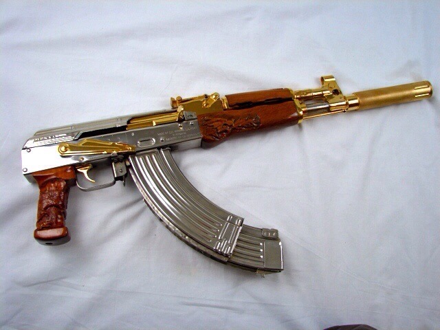 weaponslover:    Gold and silver plated Kalashnikov.   