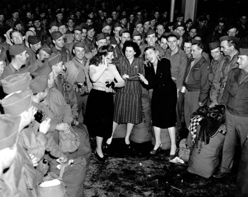 The Andrews Sisters entertaining troops during World War II (1945)