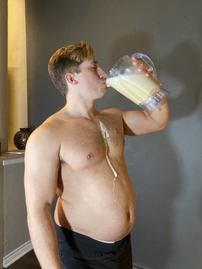 thic-as-thieves:Almost 3000 calorie shake! This is what I make him drink when he doesn’t hit his weekly weigh-in! Look at that shake roll down his growing belly 🤤 don’t worry, I made sure to lick it up 😛😈 video plus more pics on our patreon!