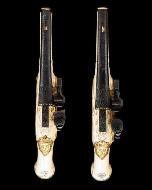 A pair of ivory stocked, gilt flintlock pistols made for King Louis XVI circa 1770.from Holt’s Aucti