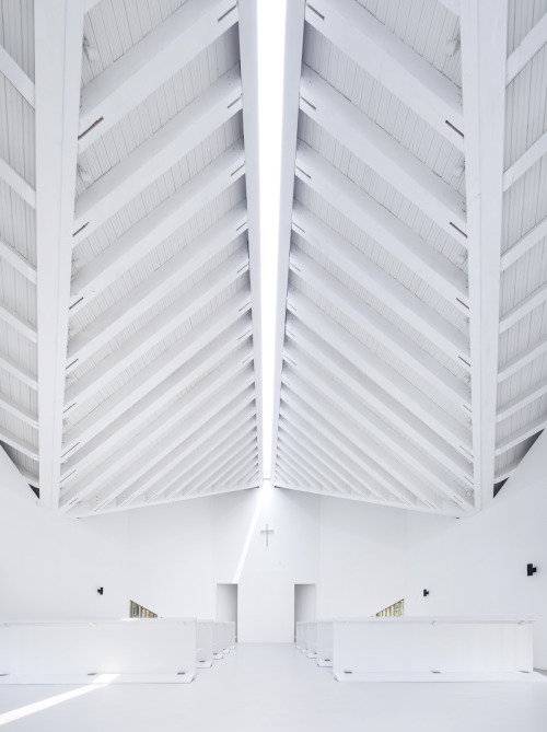 dezeen:Vertical lengths of timber mask the interior of this chapel designed by AZL Architects in eas