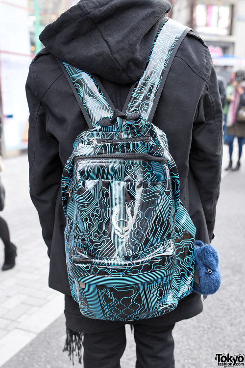 Japanese cosplayer Watson on the street in Harajuku wearing a black jacket over a Monomania hoodie, 