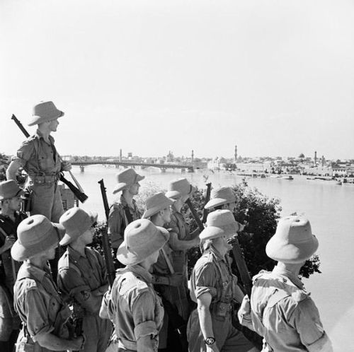 British troops wearing pith helmets looking on to Baghdad in Iraq, 11 June 1941 during the Angl