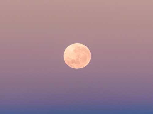 ​The full moon is setting over the Pacific Ocean, above the Earth’s shadow and the Atacama Des