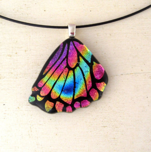 Front and rear fused glass butterfly wings I created using a rainbow mixed dichroic glass.  All