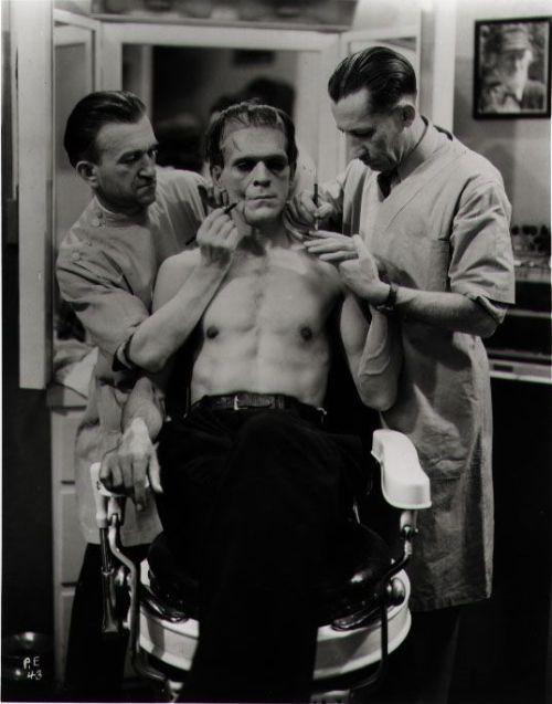 horrorgorewhore:  Karloff getting his make up done for Frankenstein. 