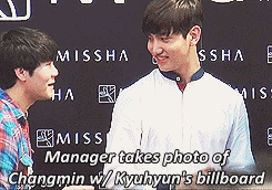 vanitysixx:Changmin’s expression when he saw Kyuhyun’s billboard at the Missha event [fancam 1 &