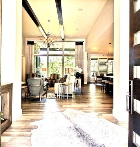 Foyer Mudroom Huge Image Of A Transitional Entryway With A Light Wood Floor, A Brown Floor, Beige Walls,