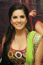 Gujarati motifs and Embroidery on her dress. Sunny Leone flashes her smile as she poses, during a pr