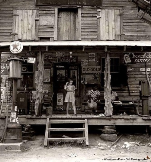 Daughter of white tobacco sharecropper at country store. Person County, North Carolina. Nudes & Noises  