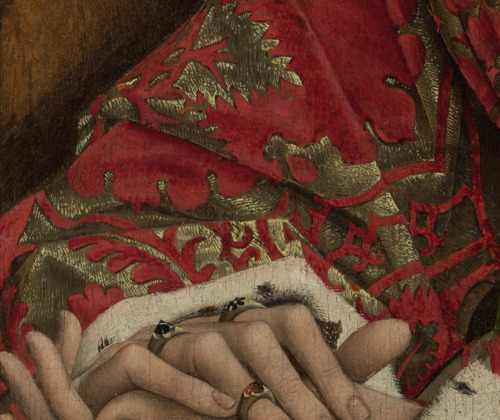 Isabella of Portugal, painted in 15th-century Netherlands.Jeweled fingers, pearls on her necklace, a
