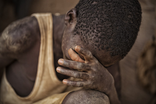 riggu:  Digging the Future by Matjaz Krivic“Yakuba (16) emerges from a 50m deep hole after another gruelling 14-hours work day underneath the panorama of western Burkino Faso. Last year his uncle and two of his friends died when a mine near by collapsed.