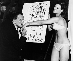 darlingirl:  Salvador Dalí kisses Raquel Welch’s hand after he paints a portrait, 1965
