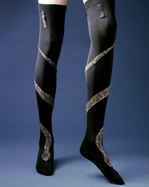 1900 embroidered black silk stockings. Silver snake made with green sequins along with green and gol