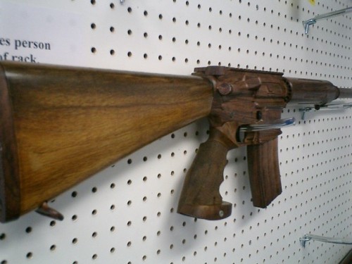 gunrunnerhell:  Woody That’s what the shop selling this AR-15 is calling it. The only actual pieces of wood on the rifle are the custom pistol grip and stock, everything else is coated in a brand new finish done by NorthWest Hydroprint.
