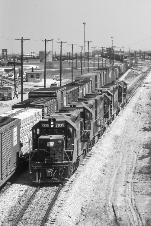 Avon YardHere we see a string of cars headed up over the hump at Avon, west of Indianapolis. This is