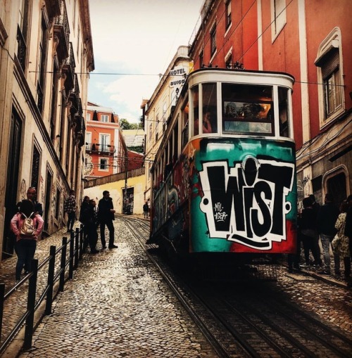 Lisbon is full of great street art, hills, trams and funicular street cars… sometimes they co