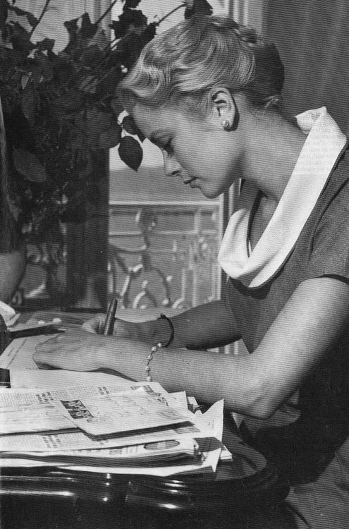 graceandfamily: Grace Kelly in her Cannes Hotel Room, 1955.