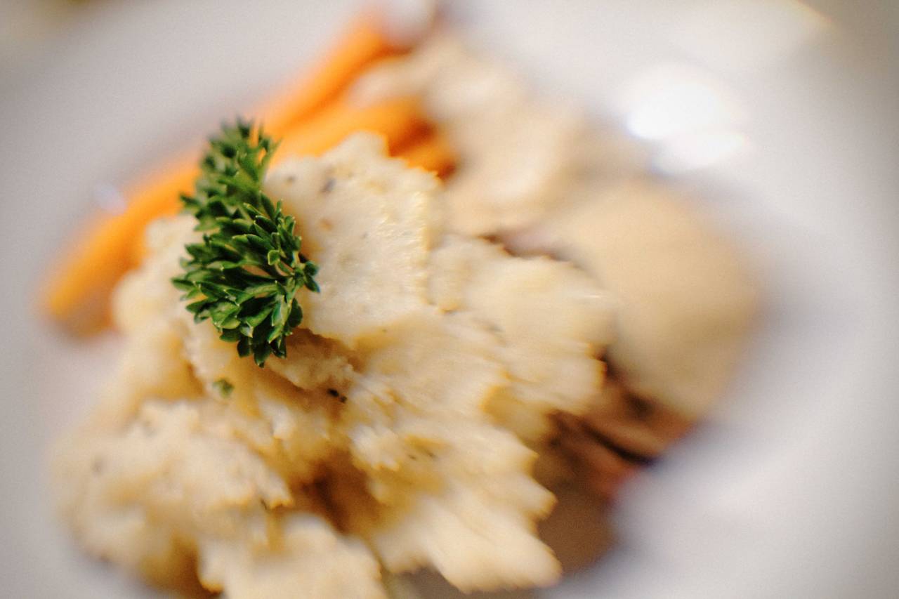 Braised rabbit in mushroom sauce with mashed potatoes and baby carrot.