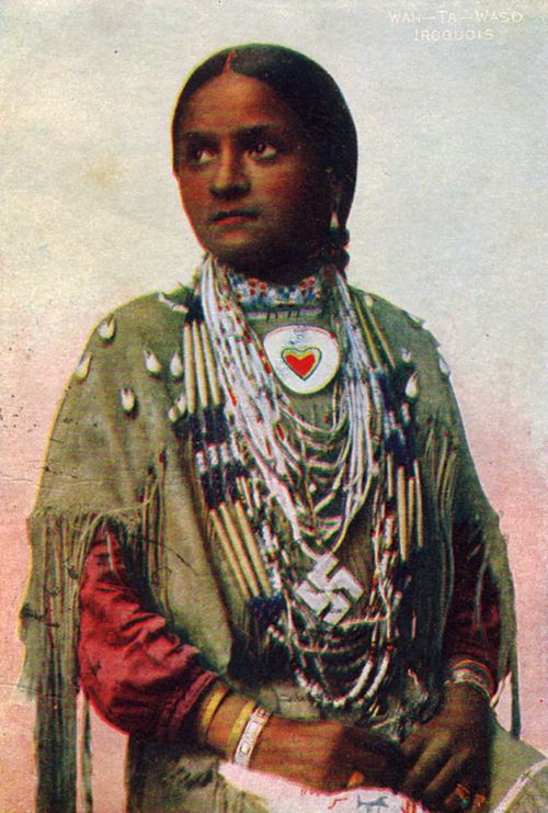 A photo from around 1900 of an Iroquois woman named Wah-Ta-Waso, with a swastika pendant. Her Americ