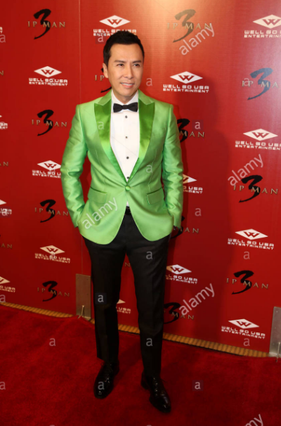 hijadepavlov: [images: first row, Rami Malek at three different events, first wearing a bright purple suit, then a pink flower-patterned suit, and last a sea-green suit.second row, John Boyega at three different events. first wearing a deep blue suit,