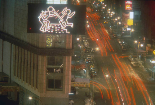 twixnmix: Keith Haring’s in front the Spectacolor Billboard showcasing his signature Radiant Baby in