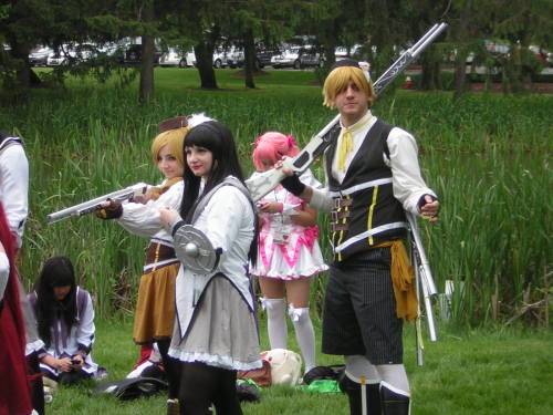 righthandminion:  Madoka Magica photoshoot at AnimeNEXT  Ahhh yay!  More pictures of us! The Sayaka farthest right that’s bent in an action pose is appledress, the Kyoko next to her is meeeee, and the tall Homura behind us is funkypriest.